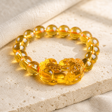 Front view of Citrine Pixiu bracelet with golden beads and amber centerpiece