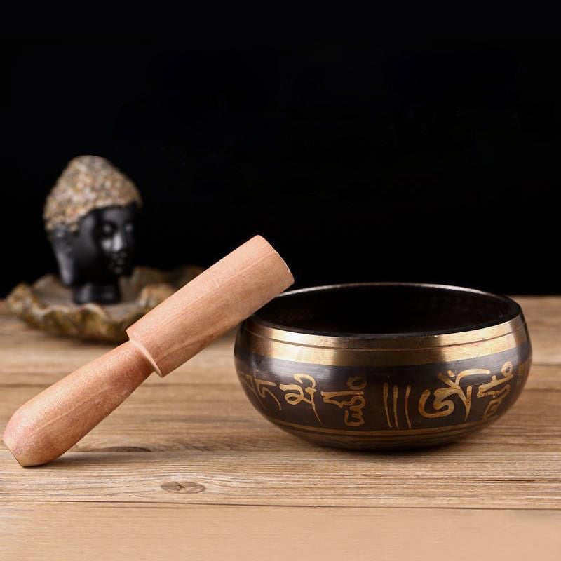 Copper Tibetan singing bowl with wooden striker for learning strike and rim techniques