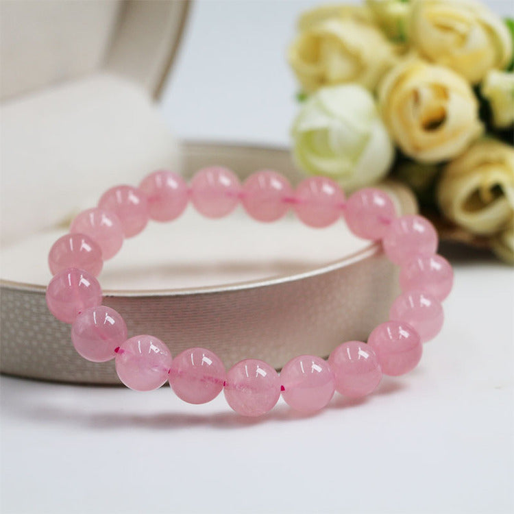 Rose quartz bracelet photographed as a symbolic love and self-love jewelry piece