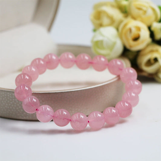 Rose quartz bracelet photographed as a symbolic love and self-love jewelry piece