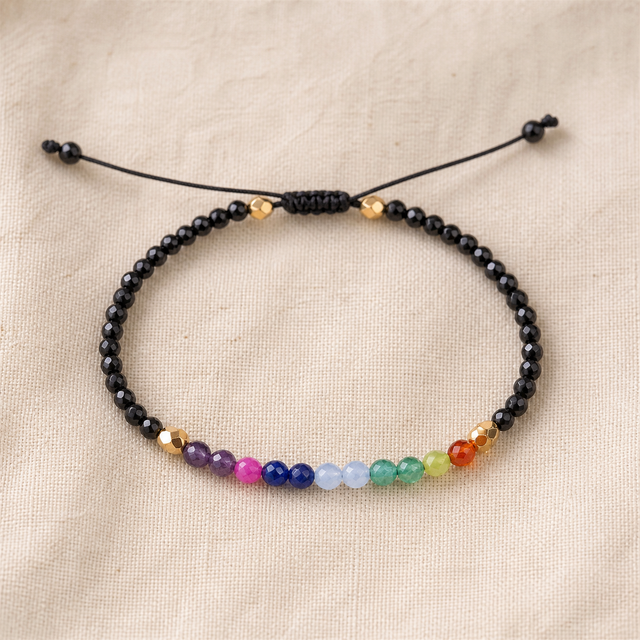 Black adjustable bracelet with multicolour faceted bead centre