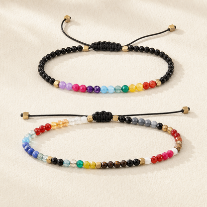 Pair of adjustable multicolour bead bracelets with black braided sliding knots