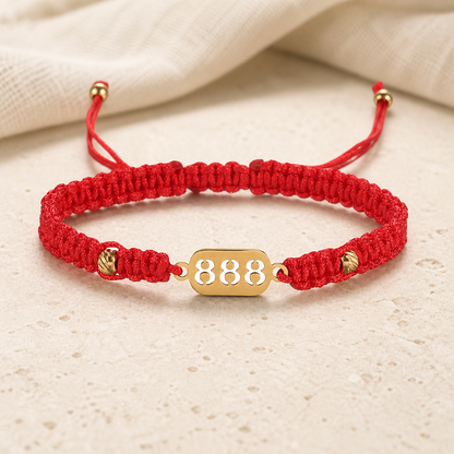 888 Angel Number Bracelet front view with adjustable red cord and gold 888 plate