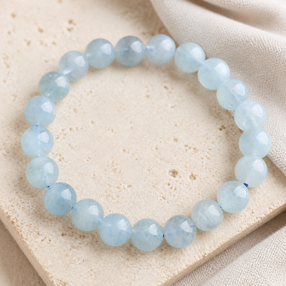Aquamarine bracelet on warm ivory stone