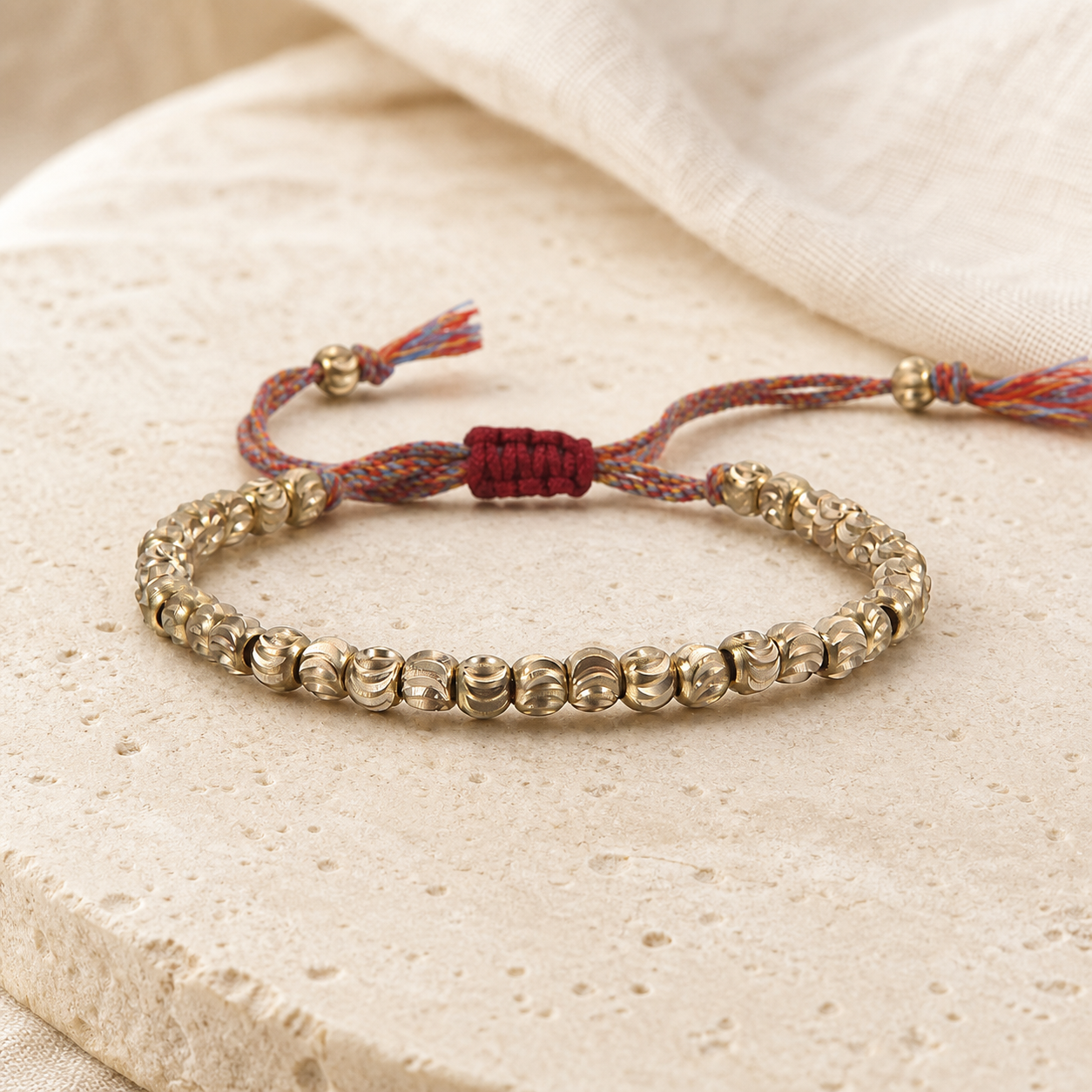 Copper Bead Bracelet full loop showing the repeating carved bead pattern and adjustable cord