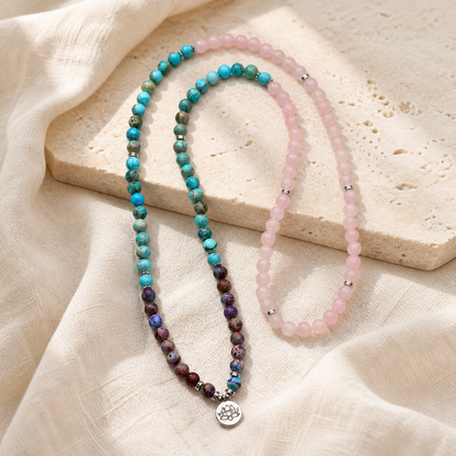 Lotus of Calm mala beads full strand arrangement on cream linen