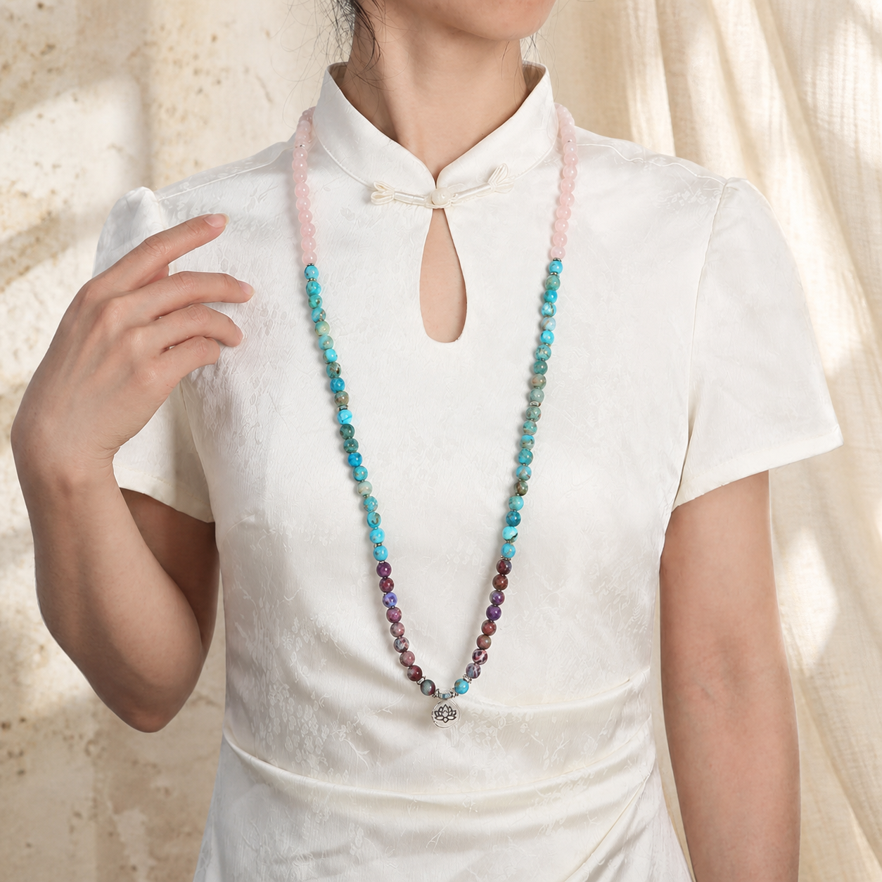 Lotus of Calm mala worn on model in white blouse