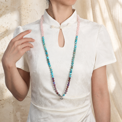 Lotus of Calm mala worn on model in white blouse